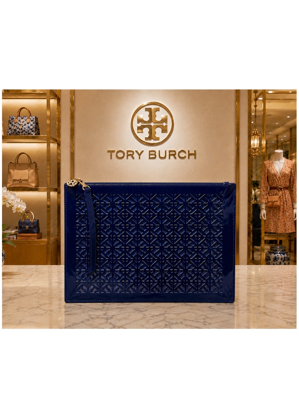 Tory Burch Limited Edition Leather Perforated Laser-Cut Wristlet.